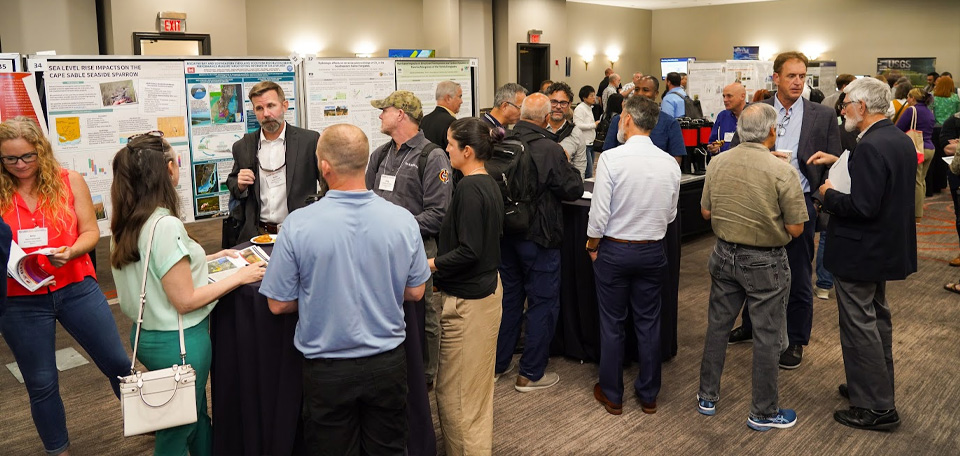 ACES attendees smile and conversate around a table