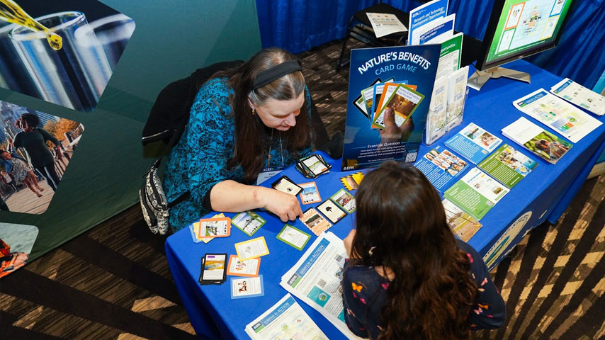 ACES exhibitors share information and play games with attendees